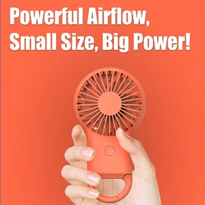 Portable mini handheld USB fan in bright orange with carabiner hook and powerful airflow
