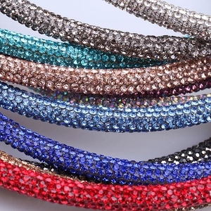 Close-up of sparkling rhinestone headbands in multiple vibrant colors for women