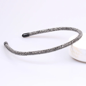 Detail of dark grey rhinestone headband with micro-crystals and protective tips
