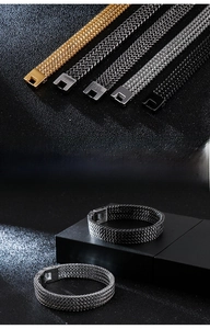 Detail of stainless steel wheat chain bracelets in gold, silver, black and antique finishes