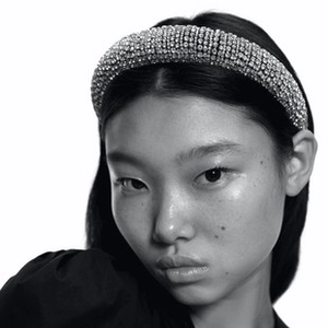 Close-up of luxury padded headband with crystal rhinestones on a female model