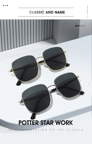 Detail view of stylish oversized square metal sunglasses in black with gold and silver frames