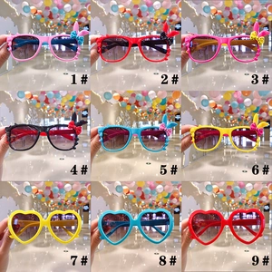 Grid view of various colorful cartoon sunglasses for kids with cute ear and bow designs