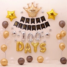 Detail of 100 days gold crown and star foil balloons with Happy Birthday banner set