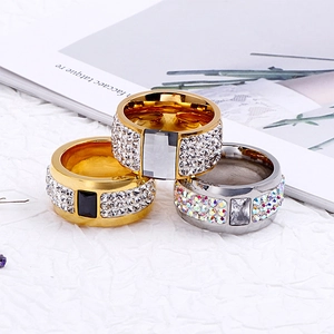 Exaggerated chunky rhinestone ring with gold and silver finishes and crystal center stone
