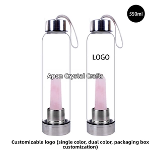 Detail of 550ml glass water bottle featuring natural rose quartz crystal and steel lid