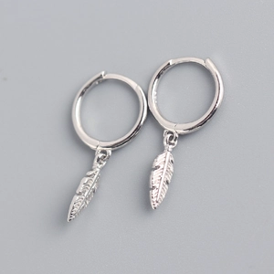 Detailed close-up of S925 sterling silver hoop earrings with delicate feather pendants