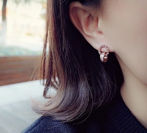 Rose gold double ring stud earrings with Roman numerals and cubic zirconia inlay
