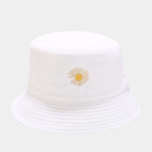 Close-up of small daisy embroidery and reinforced stitching on a white cotton bucket hat