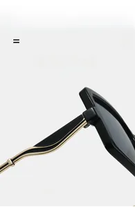 Detail shot of black oversized sunglasses showing lightweight super elastic golden metal temples