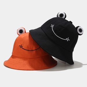 Cute frog-style bucket hat in orange and black canvas with smile embroidery decoration