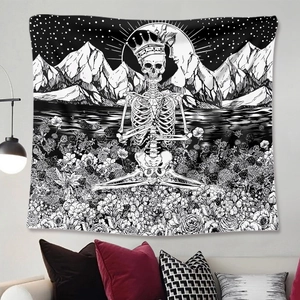 Close-up of black and white crown skull and floral tapestry hanging in bedroom
