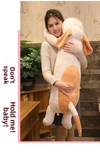 Detailed view of a long plush dog pillow held by a person to show its large size