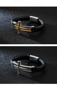 Close-up of braided leather bracelets with engraved metal crosses and magnetic clasps