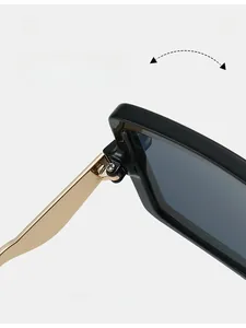 Macro shot of durable golden metal hinge on oversized black square sunglasses frame