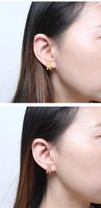 Close-up of a model wearing polished gold boy-shaped stainless steel stud earrings