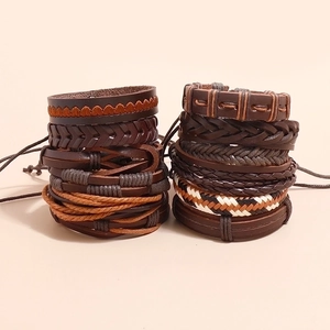 Set of 12 vintage braided leather bracelets in black and brown with various textures