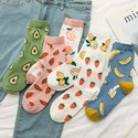 Flat lay of cotton crew socks featuring various summer fruit patterns and ribbed cuffs