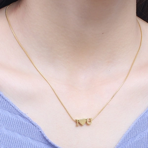 Elegant gold titanium steel necklace featuring I Love U heart pendant on a model