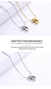 Detailed view of polished gold and silver snake chains with minimalist U-shaped pendants