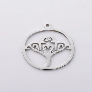 Polished stainless steel round hollow pendant with vintage manta ray filigree design