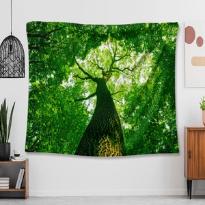 Detailed close-up of a forest landscape tapestry hanging over a wooden cabinet