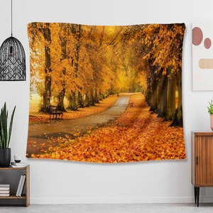Detail of forest landscape tapestry with golden autumn leaves on a white wall decor