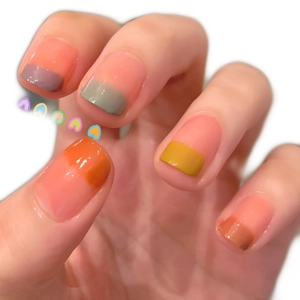 French manicure nail stickers in peach nude with multi-color jelly tips and heart accent