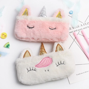 Plush unicorn pencil cases in pink and white with soft faux fur and glitter horns
