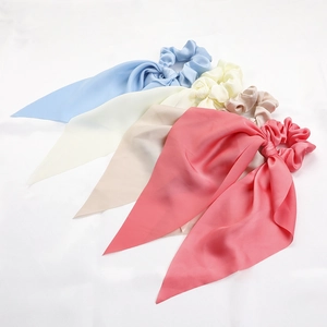 Silky satin hair scrunchies with long ribbons in light blue, beige, nude, and pink colors
