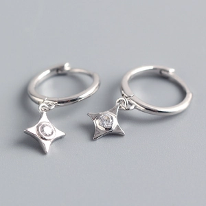 Detail of silver S925 sterling silver hoop earrings with sparkling star dangle charms