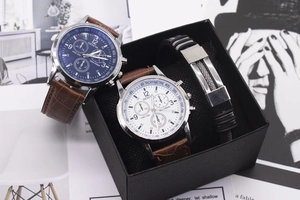 Close-up of men's watch gift set with blue and white dials and brown leather straps