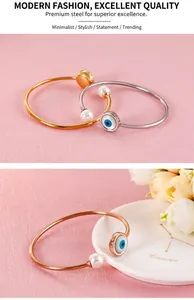 Detailed close-up of lucky evil eye bangle with pearls in gold, silver and rose gold