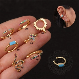Set of 7 gold U-shaped ear cuffs and studs with colorful zircons and turquoise stones