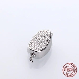 Macro view of S925 sterling silver oval clasp set with sparkling cubic zirconia stones