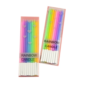 Rainbow gradient slender birthday candles with holders in a clear plastic gift box