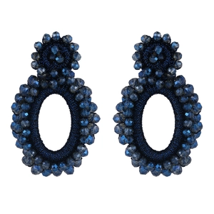 Detail of handmade deep blue beaded earrings with Bohemian geometric double-tier design
