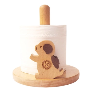 Detail of cute animal-shaped wooden paper towel holder with natural beech wood texture