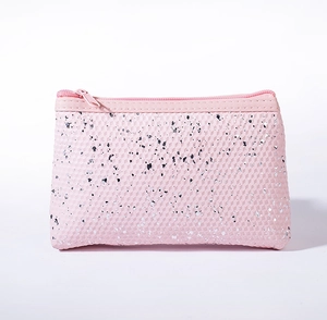 Detail of pink waterproof makeup bag with 3D diamond texture and silver sequins