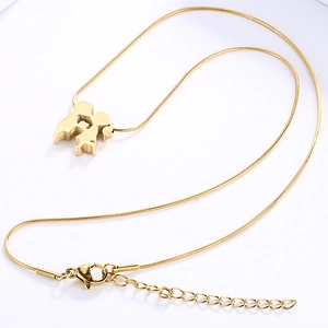 Golden stainless steel necklace featuring a snake chain and map-shaped pendant design