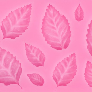 Macro shot of pink leaf-shaped silicone mold for fondant and chocolate DIY baking