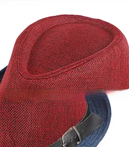 Detail of red and navy straw jazz hat showing woven texture and leather band buckle