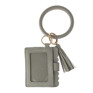 Close-up of leopard pattern wristlet key ring with grey leather card holder and tassel