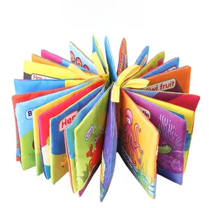 Macro detail of tear-resistant baby cloth book featuring crinkle pages and colorful animals