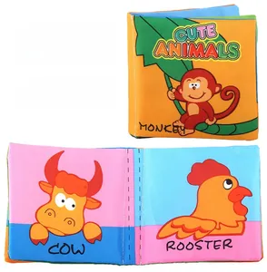 Close-up of baby fabric book with vibrant animal patterns and educational English text