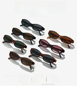 Flat lay of oval sunglasses in black, tortoise and pink frames with UV protection lenses
