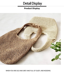 Detail of handcrafted woven straw shoulder bags in brown and beige with fabric lining