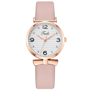 Montre tendance pour femme avec bracelet rose doré et décoration de nœud élégante