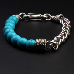 Macro detail of men's tiger stone beaded bracelet with retro stainless steel weave chain