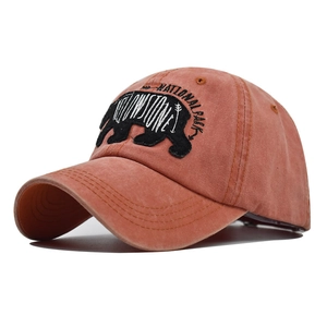 Detailed bear embroidery and Yellowstone National Park text on vintage orange cotton cap